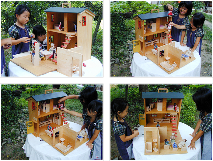「木製ボックス型のドールハウスと家具」写真